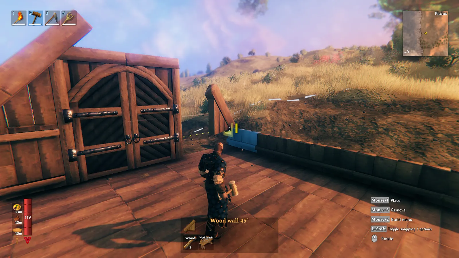Giocatore posiziona una parete di legno durante la costruzione di una base a Valheim